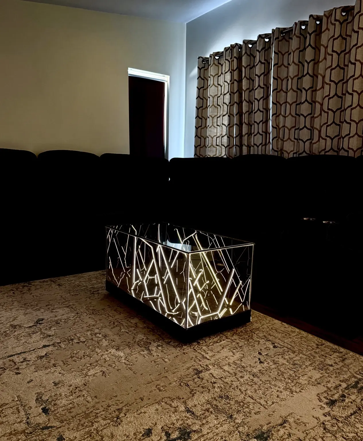 Wide view of a fixed white 36-inch Infinity Mirror table
