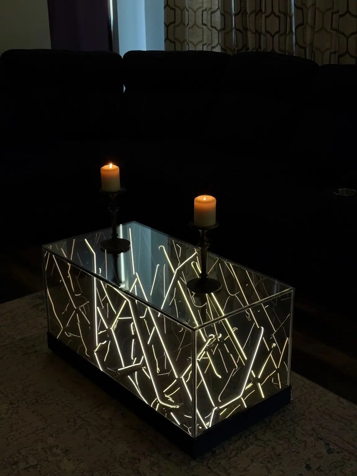 Warm white Infinity Mirror table styled with candles